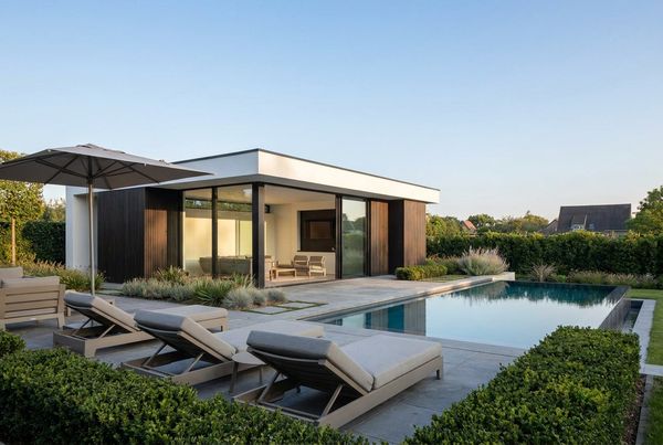 Pool house with sliding glass doors opening to the pool deck