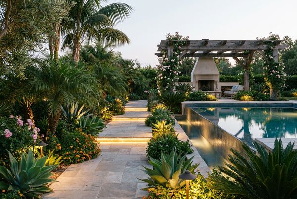 Poolside garden path lit with low-voltage landscape lighting