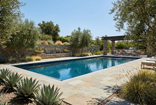 Bamboo privacy screen behind a swimming pool