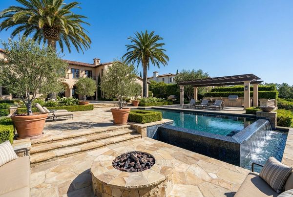 Mediterranean pool with olive trees and gravel garden