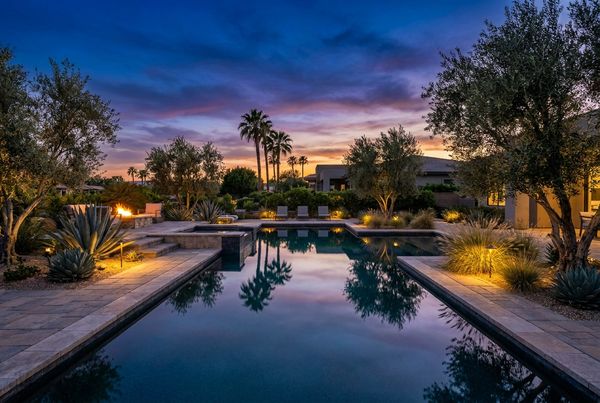 Courtyard pool surrounded by large glazed planters