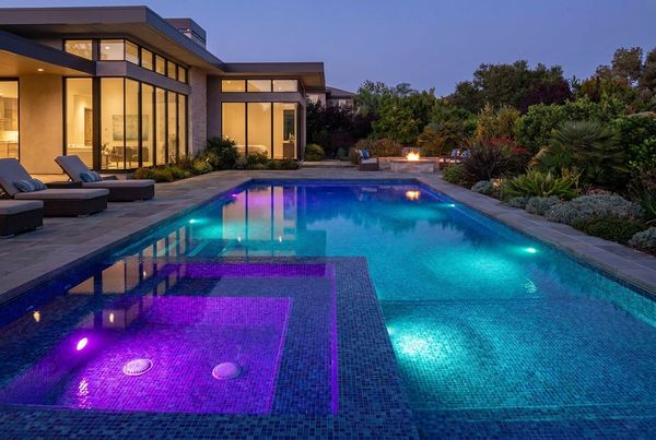 Color-changing pool light glowing purple and teal