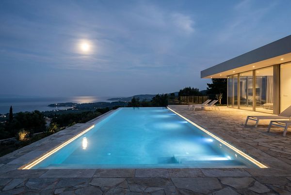 Pool at night with a soft moon-glow ambiance