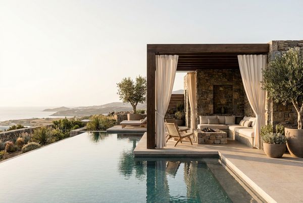 Poolside cabana lounge set up for a party with cushions and drinks