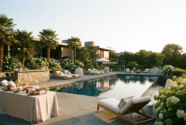 Backyard pool party setup with floats and colorful decorations