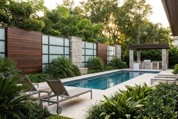 Podocarpus privacy hedge behind a pool deck