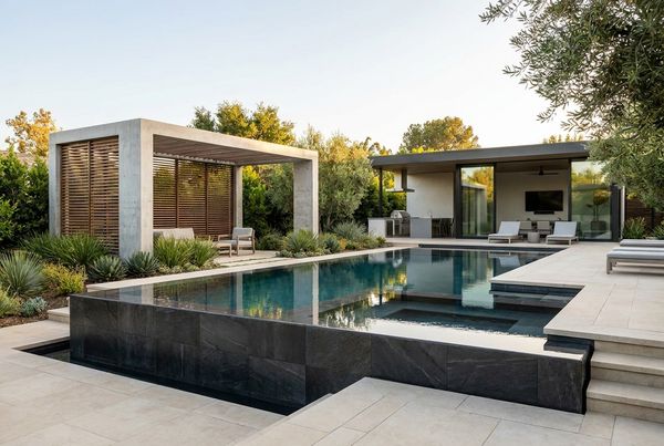 Modern remodeled inground pool with clean lines and updated finishes
