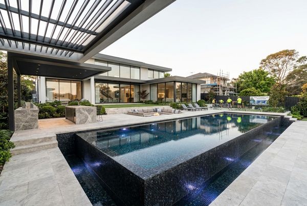 Renovated pool with a newly added raised spa and spillover