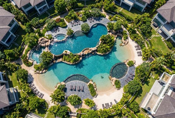 Aerial view of a freeform lagoon pool with organic curved edges