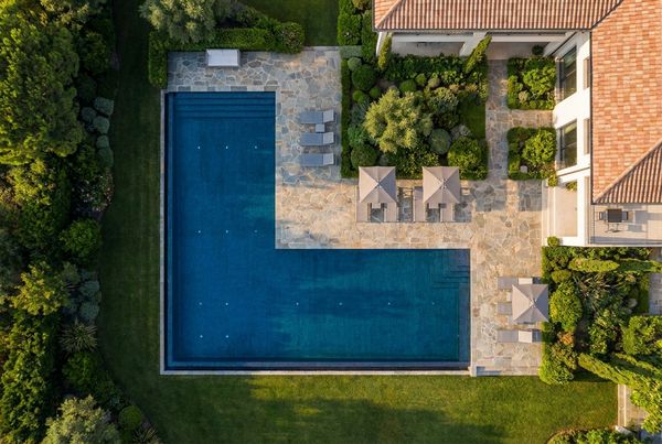 Aerial view of an L-shaped pool with separate shallow and deep zones