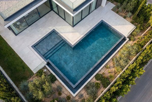 Aerial view of an angular modern pool with sharp geometry