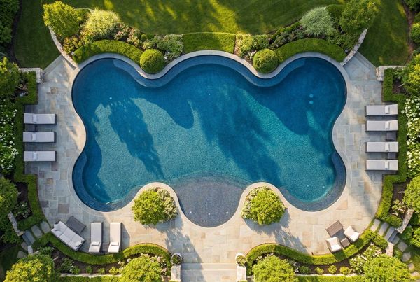 Aerial view of an L-shaped pool with a deep diving zone