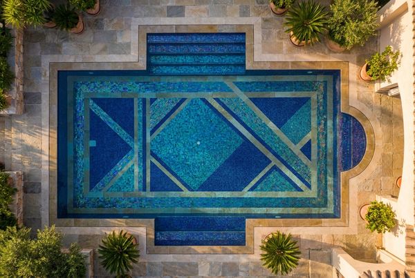 Blue penny-round tile lining a pool step