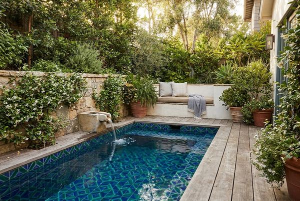 Full glass-tile pool glowing deep blue