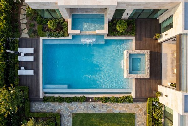 Natural stacked-rock waterfall beside a freeform pool