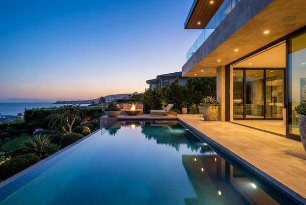 Saltwater pool glowing at dusk with warm and blue lighting