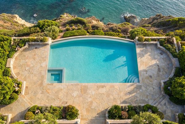 Saltwater pool glowing with blue LED lighting at night
