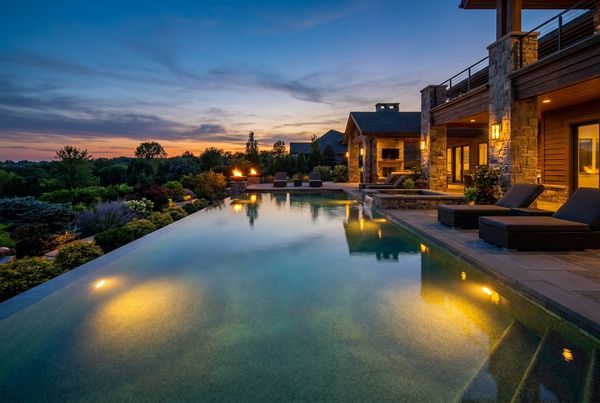 Tropical saltwater pool surrounded by palms and lush planting