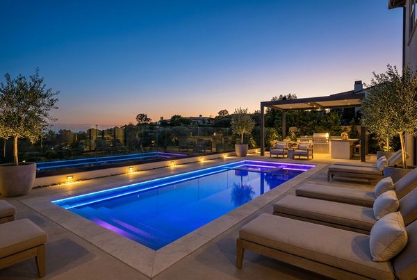 Small backyard pool at golden hour with warm lighting