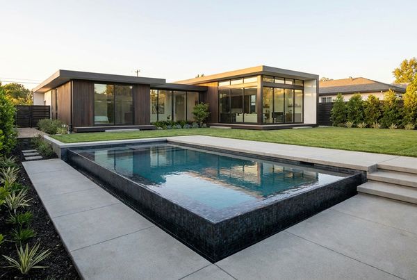 Small pool with a fire bowl feature at the water's edge