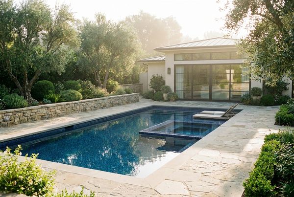 Small pool in a narrow side yard between two structures