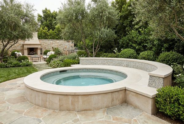 Spool pool with full-length bench seating and spa jets